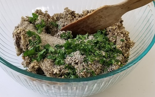 Transfer the mixture from the food processor to a large mixing bowl and add the chia seeds, parsley, black pepper, and salt. Stir the mixture until well combined.