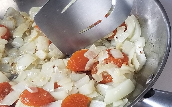 Sauté onion, garlic, and apricots in olive oil until fragrant.