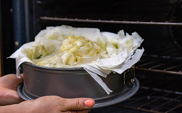 Bake the pie at 350 degrees for about 30 minutes until the top is golden brown. Remove the pie from the oven and let cool at least 15 minutes before springing from the pan.