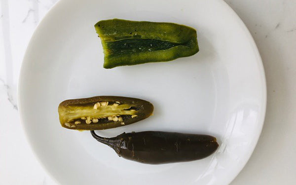 Remove chiles from brine and cut in half. Scoop out seeds and veins using a spoon or paring knife. 