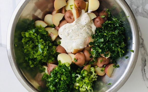 Place potatoes in a large stock pot full of cold salted water and bring water to a boil.