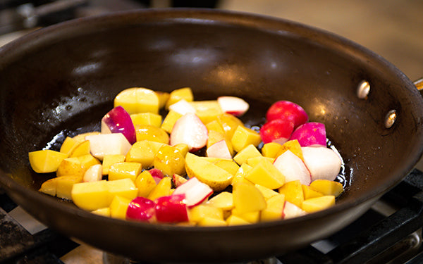 Image of vegetables sauteed in sauce pan