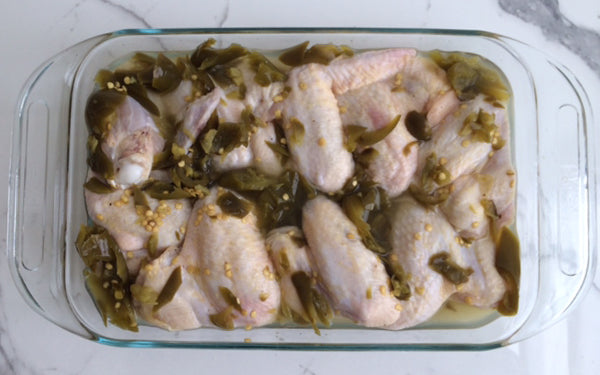 Place chicken wings in a 9”x13” glass dish. Pour pickling brine from can over wings.