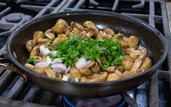 Sauté for a few minutes, tossing or stirring a few times, until the mushrooms are lightly browned and tender. 