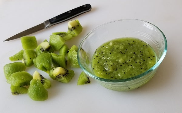 Scoop the fruit out of each kiwi and cut into large pieces.