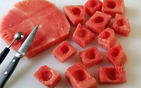 Using the most seedless parts of each slab of watermelon, cut squares out roughly 1½ inches wide.