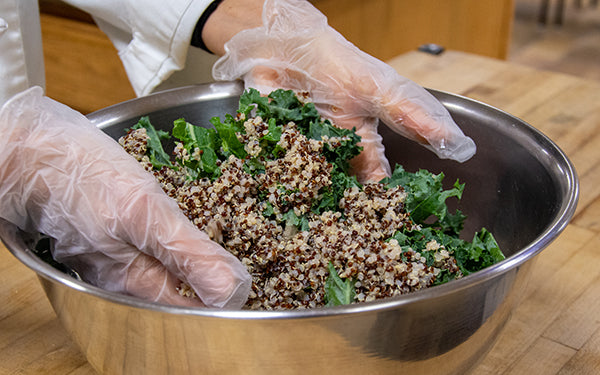 In a large bowl, mix the kale, quinoa, lemon juice and salt together and set aside for at least 30 minutes to allow the kale to soften.