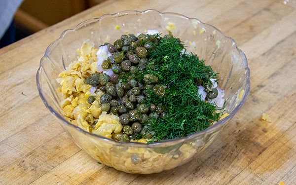 For the tuna hack, combine the flaked chick peas, shallots, capers, dill, and extra virgin olive oil. Season with salt and pepper and set aside.