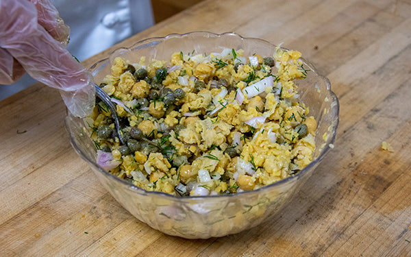 On a serving platter or shallow bowl, cover the bottom with the kale and quinoa mixture.