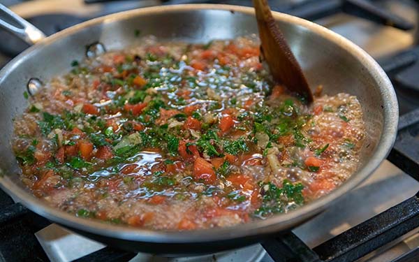 Add the bell pepper, tomatoes, cilantro, chicken broth and the remaining seasonings. Bring to a boil. Reduce the heat and simmer for 10 minutes or until the sauce thickens slightly.