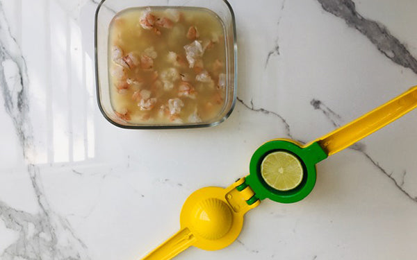 Place shrimp and citrus juices into a glass bowl and fold gently to coat. Cover and place in the refrigerator for at least 2 hours, and up to 8 hours.