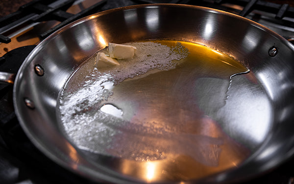 Heat olive oil and butter over medium-high heat in large sauté pan. 