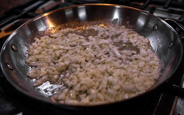 Add diced onion and sauté until soft but not browned.