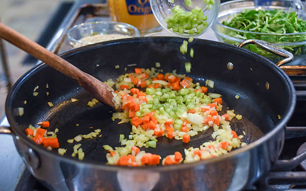 Heat the oil in a shallow 3-quart saucepan over medium-high heat. Add the onion, carrot, celery, and garlic. 