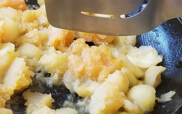 While the apples are baking, melt the butter in a sauté pan over a medium low heat, then add the squash, reserved apple pulp, and the remaining cider and sauté, covered, for 15 minutes. Stir occasionally so the mixture does not stick or burn.