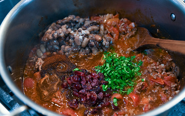 Image of beans added to chili