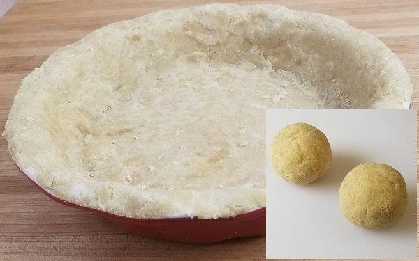 Mix all of the dry ingredients together until well incorporated. Add in the wet ingredients and mix by hand, or spoon, and combine until it forms a soft dough ball, which is divided equally into two.