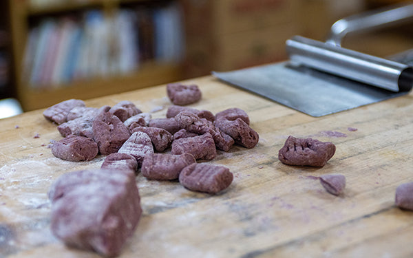 To make the Charleston Purple Yam gnocchi, combine the CPY purée with the flour, salt and pepper to form a dough. 