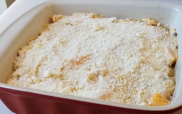 Transfer mixture to a baking dish, sprinkle with other 1/2 cup of Parmesan. 