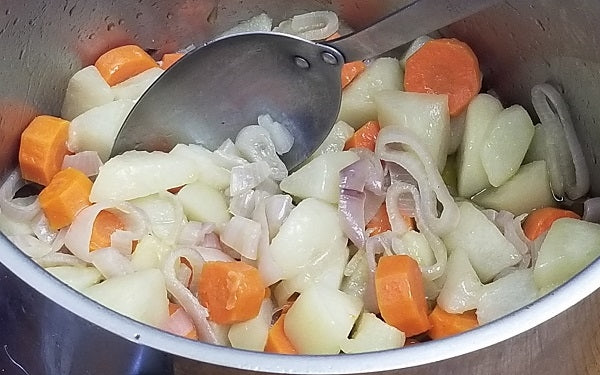 Step 2: Melt butter with oil in a large pot or Dutch oven over medium heat. Then add carrots, shallots, pears and sauté 8 to 10 minutes until tender.