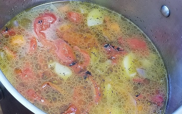 Step 3: Stir in jar of red bell peppers, chicken broth, salt, and pepper. Bring to a boil, cover, reduce heat to low, simmer 25 to 30 minutes. Let cool 20 minutes.