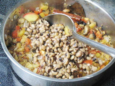 Image of adding black-eyed peas to filling