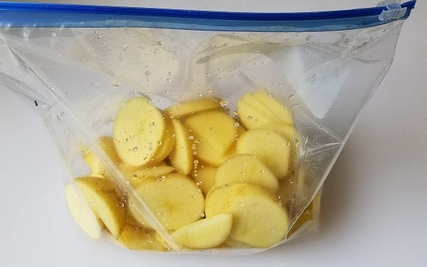 Placed rinsed potatoes, still wet, in zip lock bag. Microwave until cooked through. Set aside.