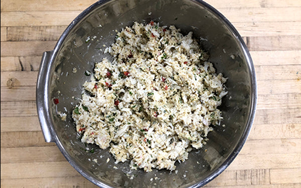 Preheat the oven to 375 degrees. In a large mixing bowl, combine the crabmeat, the remaining ingredients (except for the garnishes), and the cooled, cooked quinoa. 