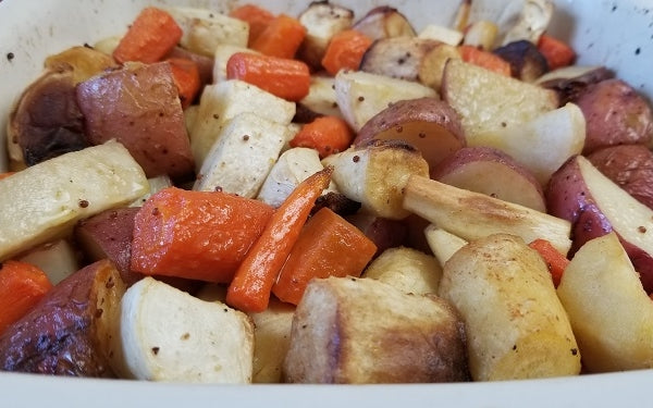 When the roots have cooked, pour the glaze over the vegetables and gently toss so they are evenly coated.