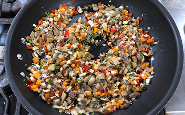 In a large pan, sauté the shallots, carrots, and bell peppers in olive oil about 3-4 minutes until tender. 