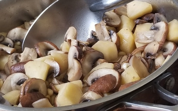 While the veggies are roasting, sauté garlic in butter for about five minutes before adding apples and pine nuts to cook for another five minutes, lastly add in the mushrooms to simmer until tender. 