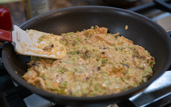 Heat oil in an 8-inch nonstick skillet or flat griddle over medium. Spread batter evenly in skillet. Cover and cook until bottom is browned, about 5 minutes.