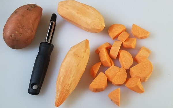 Peel and chop the yams into small chunks. Bring water to boil in a large pot fitted with a steamer basket. Add sweet potatoes, cover and steam until very soft, 15 minutes.