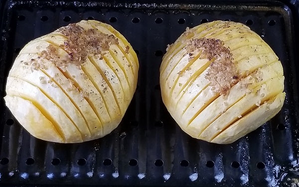 Remove from oven, open foil and pour melted butter back over top of the rutabagas. 