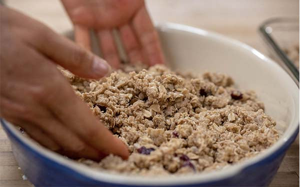 Preheat oven to 250 degrees Fahrenheit. Combine oats, soy flour, wheat germ, dry milk, bran, coconut if using, walnuts, and seeds in a large mixing bowl.