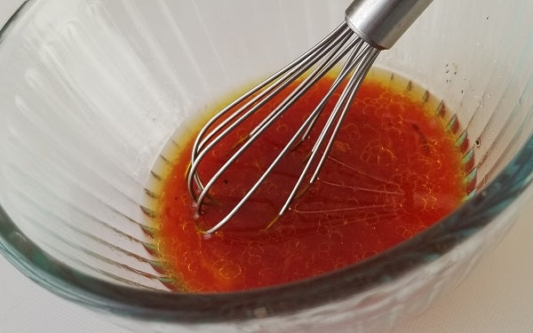 In a small bowl whisk together the orange juice, rice vinegar and agave; then gradually whisk in the olive oil. Season with salt and pepper, to taste. Drizzle the dressing generously over the citrus slices and serve. 