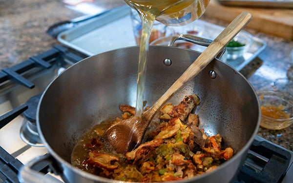 Stir the roasted red pepper puree into the pot until combined. Add in the rehydrated lobster mushrooms, the broth, the sherry or white wine and the cashew “cream”. 