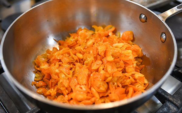 For the kumquats, take a thin slice off the top and bottom. And then slice the kumquat thinly (horizontally), in 4 – 6 slices. Remove any seeds and discard. 