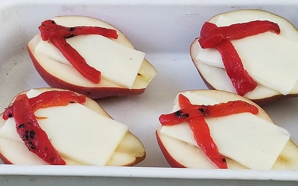 Arrange the pears cut side up in a baking dish and drizzle ½ the agave over them. 