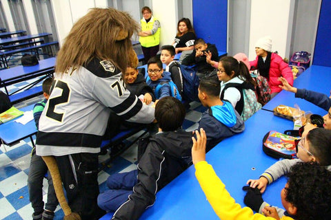 Image of school mascot with kids