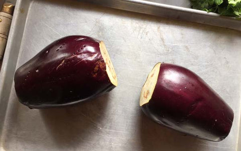 Image of Wash and dry the eggplant. Cut off stem end. Pierce skin with a fork to prevent eggplant from bursting during roasting