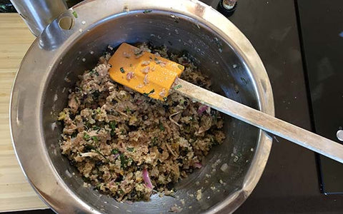 Image of Measure cooked quinoa into a medium mixing bowl