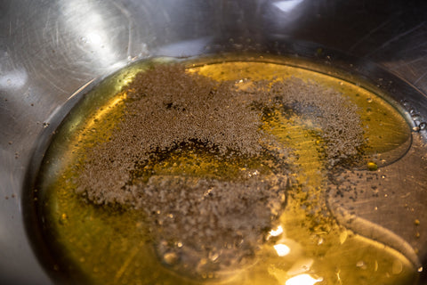Image of oil, water, yeast and agave in a mixing bowl