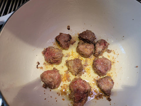 Image of Pat dry beef cubes with a paper towel and lightly dust with salt and pepper