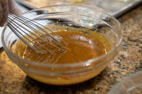 Image of whisking dressing ingredients