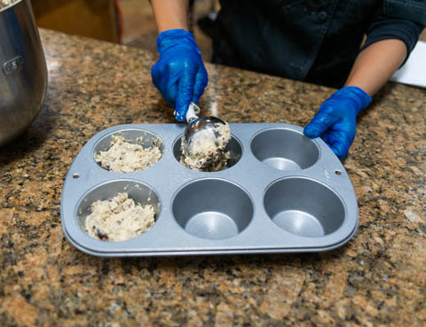 Image of pouring batter into muffin tins