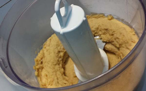 Image of Place Melissa’s pre-cooked chickpeas in a food processor and process until smooth