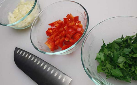 Image of Dice onion, bell pepper, parsley