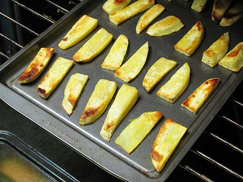 Image of potato wedges on baking sheet