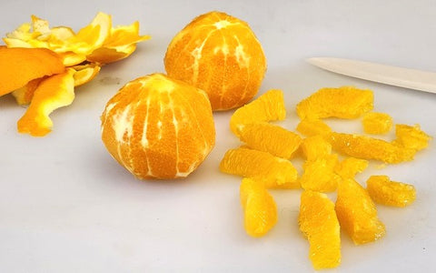 Image of peeled and segmented orange